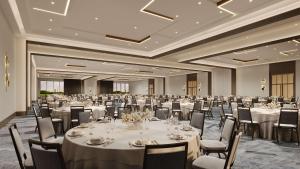 a large banquet room with tables and chairs at Hilton Jacksonville At Mayo Clinic in Jacksonville