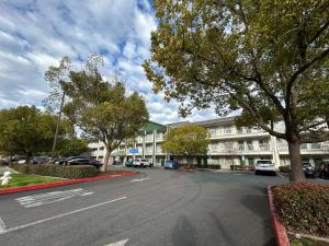 an empty street in front of a large building at Studio 6 Rancho Cordova, CA in Rancho Cordova
