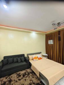 Ένα ή περισσότερα κρεβάτια σε δωμάτιο στο affordable transient house in gensan +12 φωτογραφίες