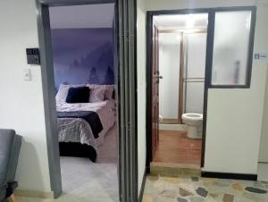 Postel nebo postele na pokoji v ubytování Hospedaje la Magia de Zipaquirá