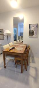 a wooden table in a living room with a couch at Cebu Homestay Rental in Mandaue City +12 photos