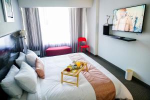 Postel nebo postele na pokoji v ubytování Apart Hotel Petit Palace Suites
