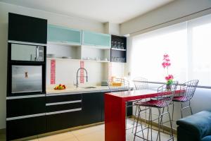 Kuchyň nebo kuchyňský kout v ubytování Apart Hotel Petit Palace Suites