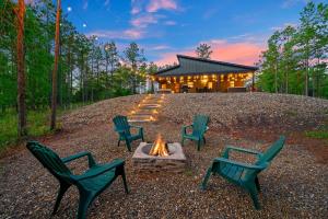 a group of chairs sitting around a fire pit at The Animal Crossing -Direct ATV trail access, hot tub, and fire pit near Hochatown in Broken Bow