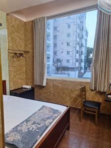 Postel nebo postele na pokoji v ubytování Văn An Hotel