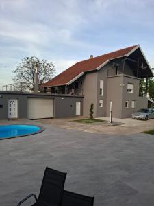 a house with a car parked in the driveway at Maja in Velika Gorica