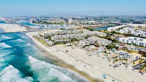 an aerial view of a beach with buildings and the ocean at Panoramic Water Views - Steps to the Beach - F-2 in Oceanside