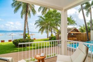 a view of the ocean from the balcony of a villa at Baan Bophut Beach Hotel Samui - SHA Extra Plus in Bophut