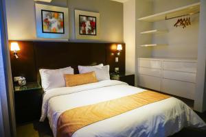 Postel nebo postele na pokoji v ubytování Apart Hotel Petit Palace Suites