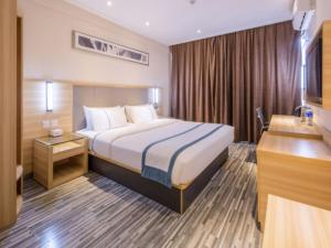Postel nebo postele na pokoji v ubytování City Comfort Inn Deyang Wenmiao Square Gymnasium