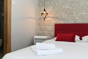 Postel nebo postele na pokoji v ubytování Apartmani Drijen