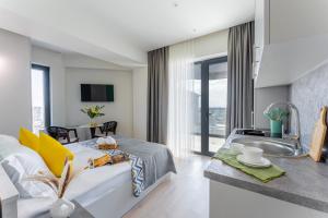 TV a/nebo společenská místnost v ubytování Sunset Apart-Hotel