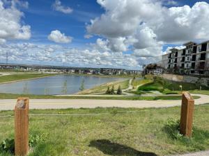 a large body of water next to a building at Exquisite Entire 4- Bed rooms vacation home! in Calgary