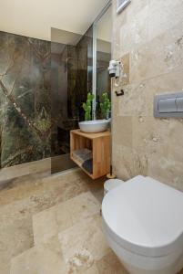 a bathroom with a toilet and a sink at Astria Siena - Complex Novum in Olimp +30 photos