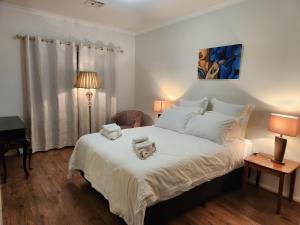 Beaumont Waters Unit,2 bedrooms,3 beds客房内的一张或多张床位