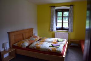 Ein Bett oder Betten in einem Zimmer der Unterkunft Penzion Ida