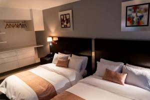 Postel nebo postele na pokoji v ubytování Apart Hotel Petit Palace Suites