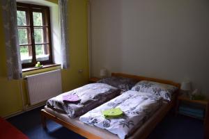 Ein Bett oder Betten in einem Zimmer der Unterkunft Penzion Ida