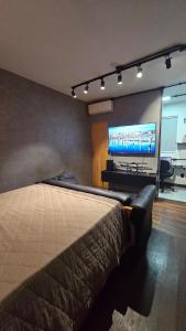 Et tv og/eller underholdning på Excellent Studio in Caiçara