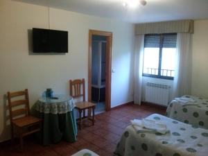 Katil atau katil-katil dalam bilik di Hotel Rural el Arco