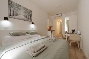 Postel nebo postele na pokoji v ubytování Zagreb ART24 Apartments