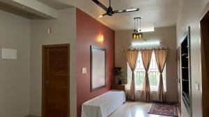 een woonkamer met een deur en een raam bij Vintage Coffee Premium Villa in Pinangode