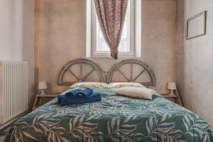 Posteľ alebo postele v izbe v ubytovaní Trieste Art Loft