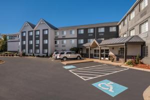 a parking lot in front of a large building at MainStay Suites Chattanooga Hamilton Place in Chattanooga