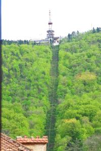an overhead view of a hill with a tower on it at Arina Apartments 2 in Braşov