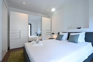Giường trong phòng chung tại Lugano Suite modern concept 3