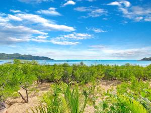a view of the ocean from a beach at Absolute Beachfront and Pool House in Horseshoe Bay