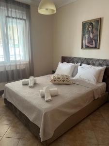 a bedroom with a large bed with towels on it at Seaside Apartment in Vergia in Vergia
