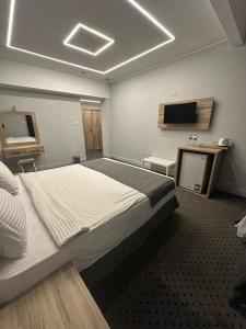 Postel nebo postele na pokoji v ubytování Atlas International Hotels