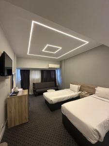 Postel nebo postele na pokoji v ubytování Atlas International Hotels + 37 fotografií
