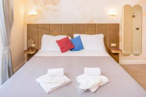 Postel nebo postele na pokoji v ubytování I Tre Re Rooms + 29 fotografií