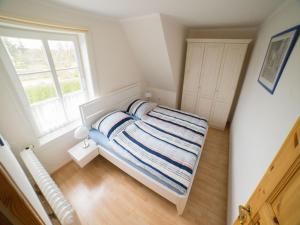 Postel nebo postele na pokoji v ubytování Haus am Deich