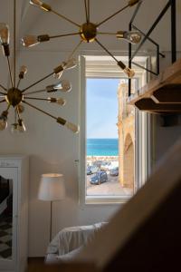 Ένα ή περισσότερα κρεβάτια σε δωμάτιο στο Fronte Mare Casa Daspa
