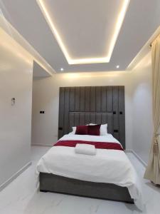 Postel nebo postele na pokoji v ubytování Nimbus Nook Apartments, GRA Ikeja, Lagos