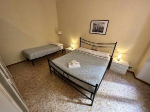 A bed or beds in a room at Rhome Holiday Mameli