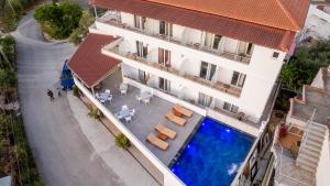 an overhead view of a building with a swimming pool at Hotel Perla Ksamil in Ksamil