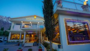a building with a sign that reads lesko saccario at Legend Hotel Skardu in Skardu