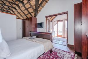 Postel nebo postele na pokoji v ubytování Welwitchia Home