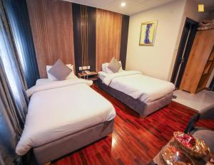 Posteľ alebo postele v izbe v ubytovaní Legend Hotel Skardu