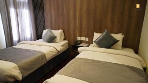 Posteľ alebo postele v izbe v ubytovaní Legend Hotel Skardu