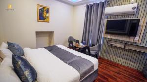 Posteľ alebo postele v izbe v ubytovaní Legend Hotel Skardu