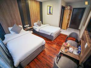 Ліжко або ліжка в номері Legend Hotel Skardu