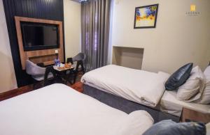 Ліжко або ліжка в номері Legend Hotel Skardu