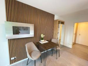 a dining room with a table and two chairs at Vision - Apartment 27 - Bad Klosterlausnitz in Bad Klosterlausnitz