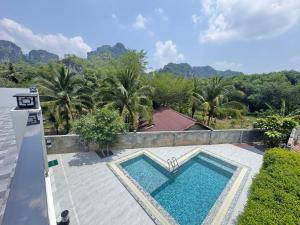 an image of a swimming pool on the roof of a house at Beewell Villa Aonang in Ao Nang 