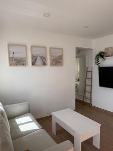 a living room with a couch and a table at Vv Estudio88 in Valverde